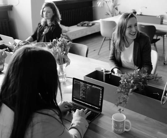 image of women sitting at a table